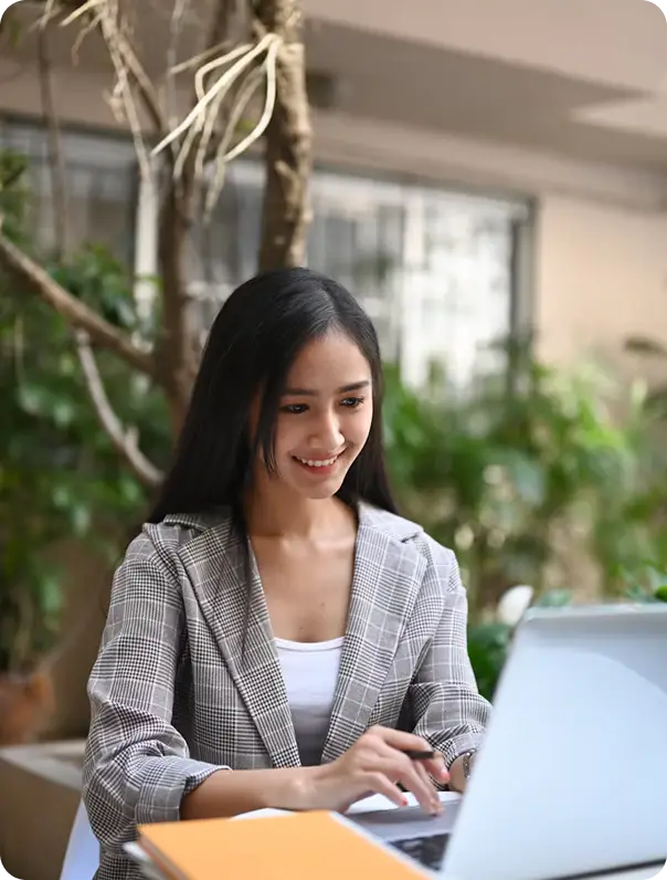 woman mortgage broker sitting in front of laptop