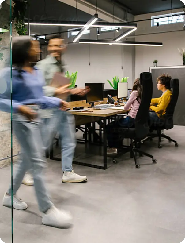 Coworkers walking in modern office
